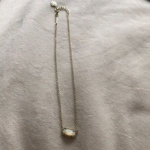 Kendra Scott gold necklace with white iridescent stone. Great condition